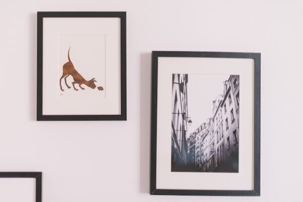 Framed images on a wall for personalizing space